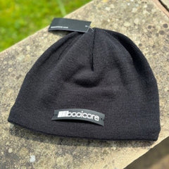 front view of black beanie from booicore with white logo badge