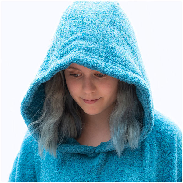 Young girl wearing booicore towel robe with hood after swimming eco friendly